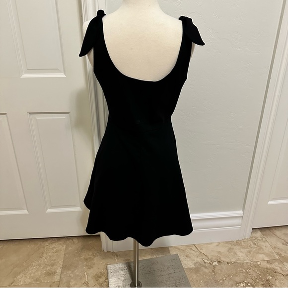 Fun short black knit flirty bow strap day dress. - Picture 5 of 6
